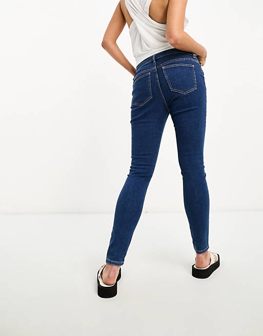 ASOS DESIGN Maternity skinny jeans in mid blue with over the bump waistband  | ASOS