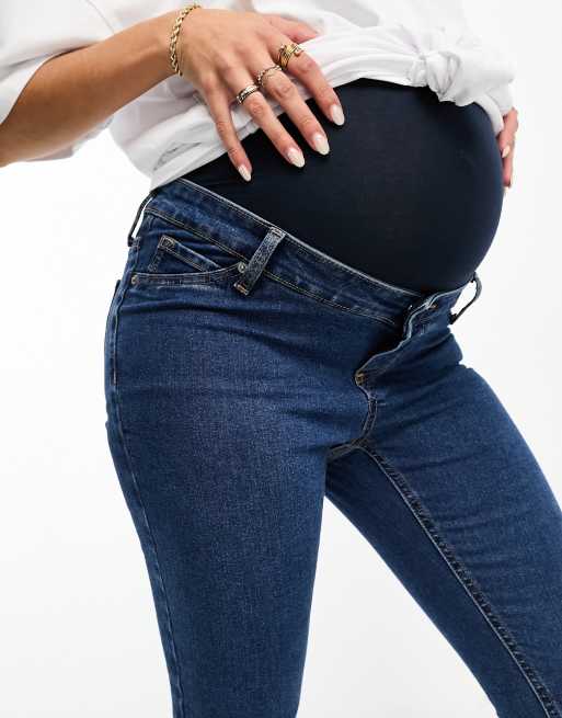 ASOS DESIGN Maternity skinny jeans with over bump in mid blue ASOS