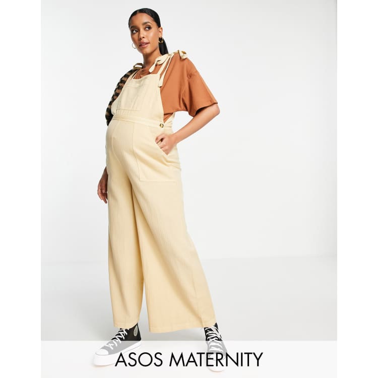 ASOS DESIGN Maternity textured tie shoulder dungaree in washed stone ASOS