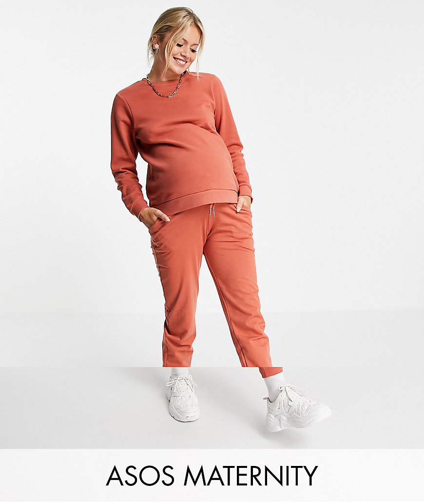 ASOS DESIGN Maternity tracksuit with slim sweatshirt/underbump sweatpants in clay-Brown