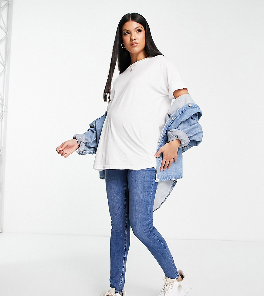 ASOS DESIGN Maternity ultimate skinny jeans in authentic mid blue with under the bump waistband