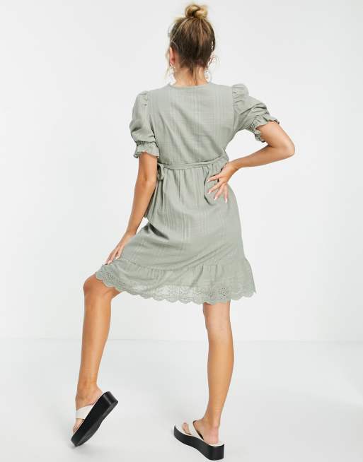 ASOS DESIGN Maternity wrap mini dress with broderie trim in self check in sage green