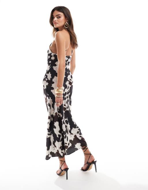 ASOS DESIGN maxi bias cut slip dress with trim detail in cow print