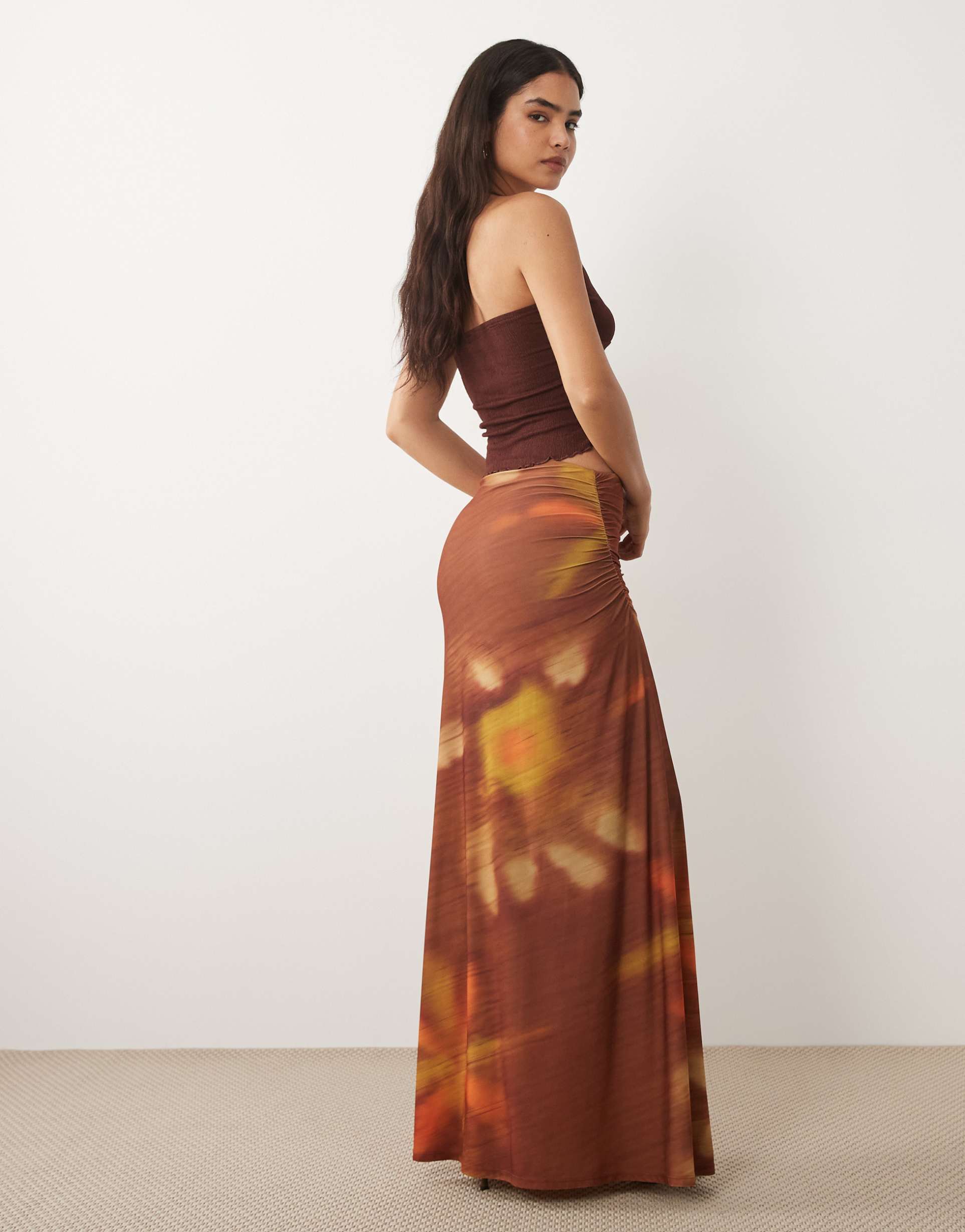asos design maxi skirt with ruched side detailing in blurred sunset print