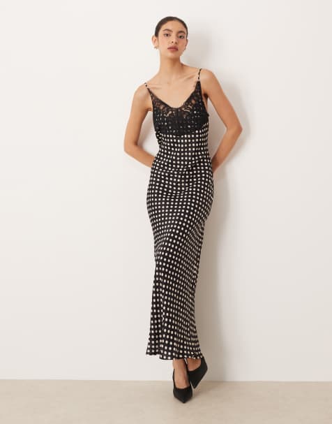 ASOS DESIGN – Maxikleid aus Satin in Schwarz gepunktet mit Spitzenoberteil mit Camisole-Trägern - view 1