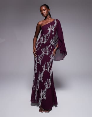 ASOS DESIGN - Maxikleid in Pflaumenlila mit Schrägschnitt, Fransenverzierung und Cape-Ärmeln