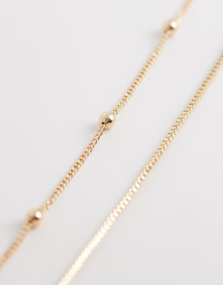 ASOS DESIGN - Mehrreihige Bauchkette in Goldoptik mit Kugel- und Stabdetails-Goldfarben