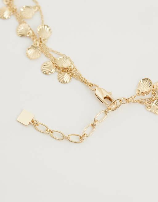ASOS DESIGN – Mehrreihige, goldfarbene Halskette mit Mini-Muschelanhängern, 3 von 4