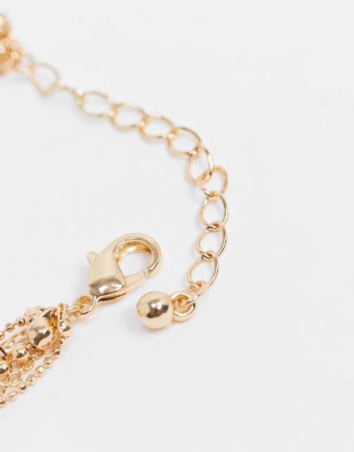 ASOS DESIGN – Mehrreihige, goldfarbene  Halskette mit runder Schleife und Sternanhänger, 4 von 4
