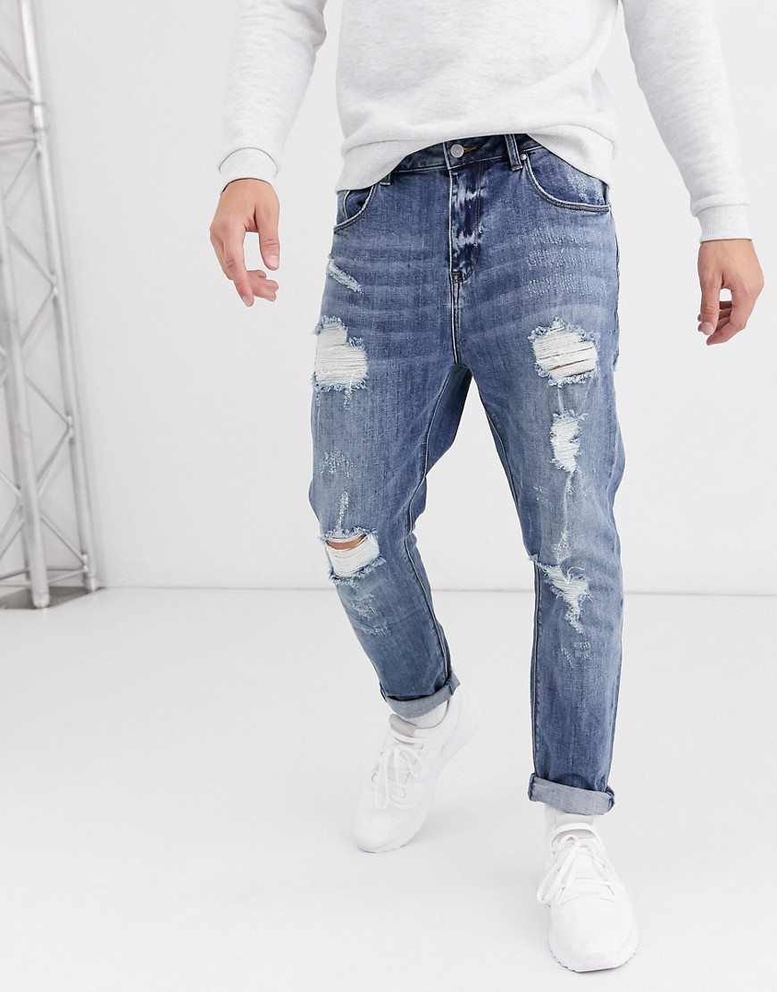 ASOS DESIGN – Mellanblå avsmalande jeans med stora revor