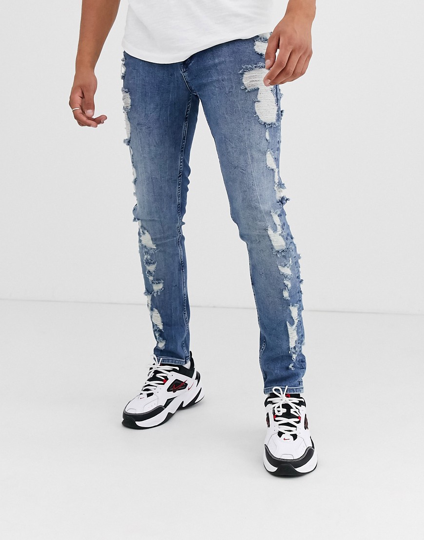 ASOS DESIGN – Mellanblå skinny jeans med extrema slitningar