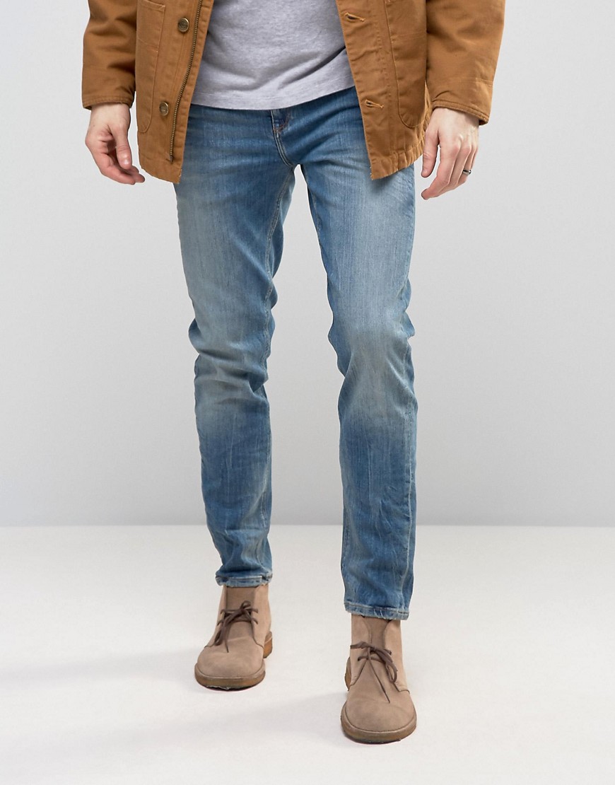 ASOS DESIGN – Mellanblå slim jeans med stretch i 12,5 oz denim