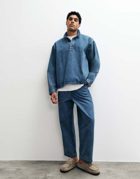 ASOS DESIGN – Mellanblå, tvättade och avsmalnande jeans med avslappnad passform, veck och spänne - view 1