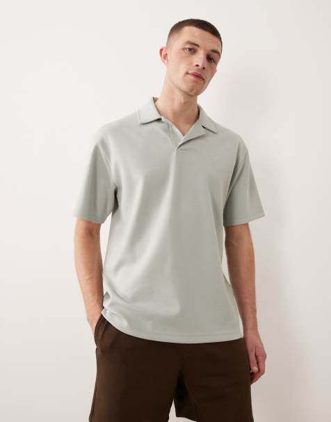 ASOS DESIGN – Mellangrön, kraftig pikétröja med avslappnad passform och tryck på bröstet - view 1