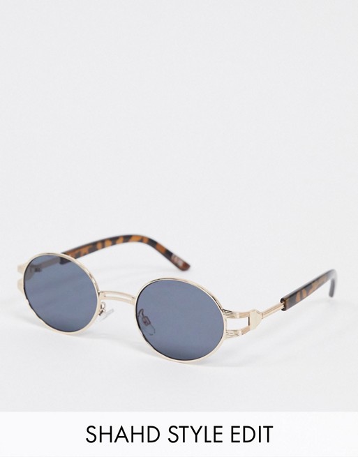 ASOS DESIGN metal oval sunglasses in shiny gold with temple detail