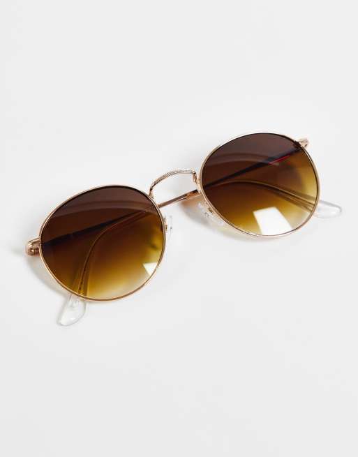ASOS DESIGN metal round sunglasses in gold with brown lenses , 2 of 4