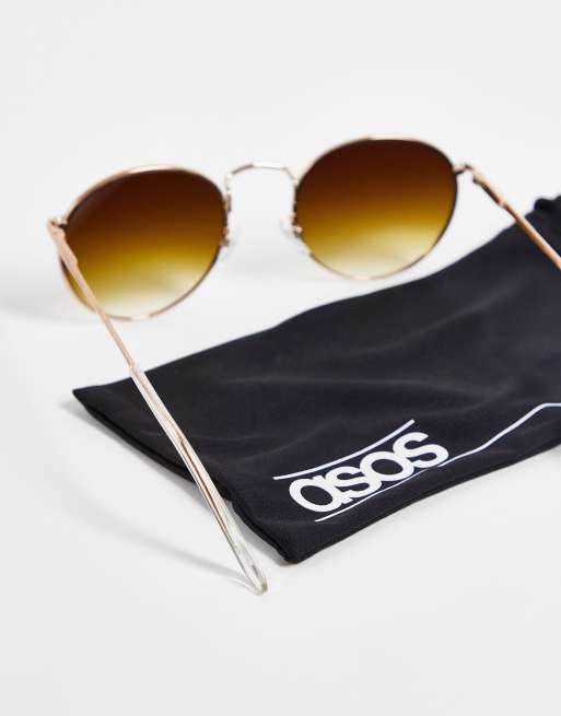 ASOS DESIGN metal round sunglasses in gold with brown lenses , 3 of 4