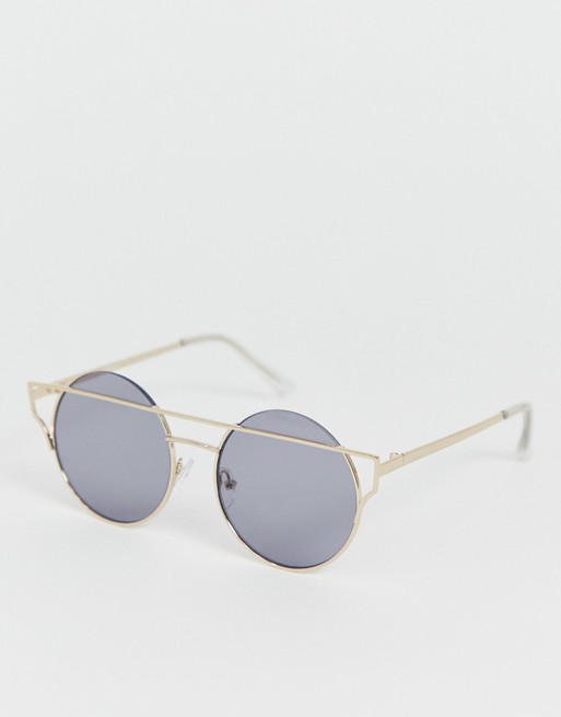ASOS DESIGN metal round sunglasses in gold with smoke lens and angled brow detail