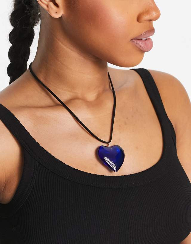 ASOS DESIGN mid length cord necklace with blue puff heart