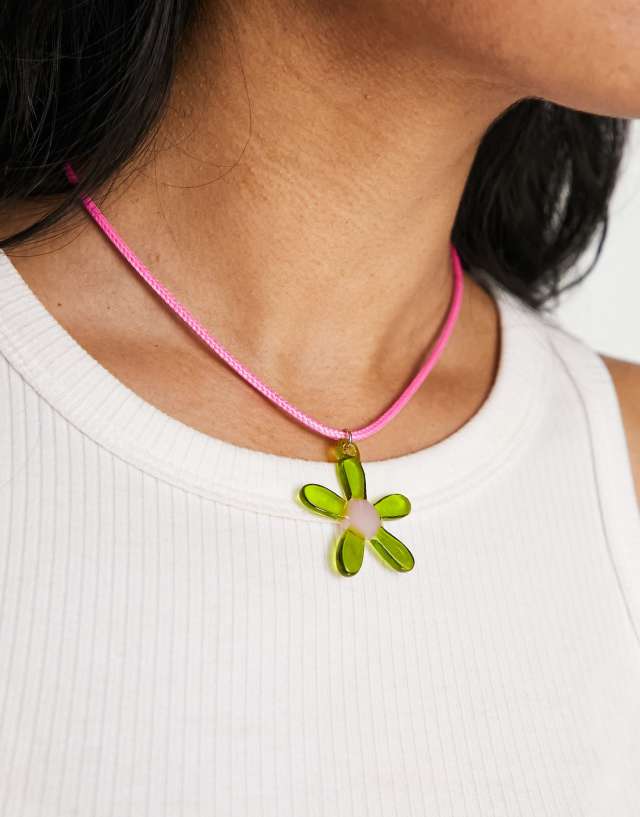 ASOS DESIGN mid length cord necklace with flower pendant in pink