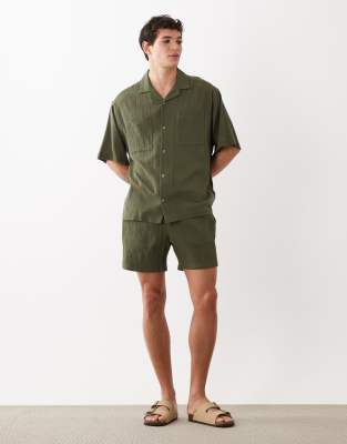 ASOS DESIGN mid length crinkle texture shorts in dark green (part of a ...