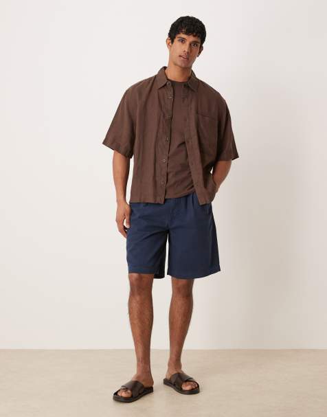 ASOS DESIGN mid length double pleated shorts in navy - view 1