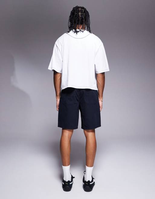 ASOS DESIGN mid length pleated shorts in navy