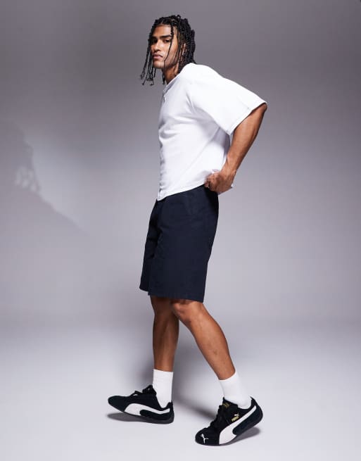 ASOS DESIGN mid length pleated shorts in navy