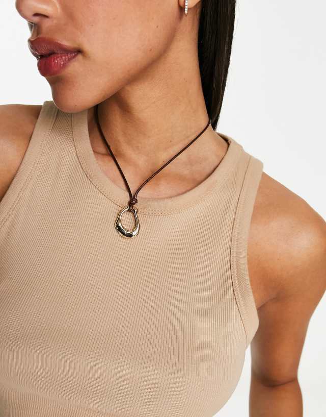 ASOS DESIGN mid length rope necklace with abstract pendant in gold tone