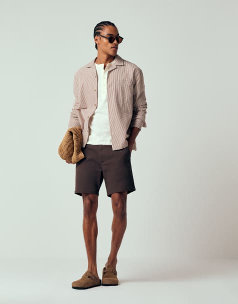 ASOS DESIGN mid length skinny fit chino shorts in brown - view 1