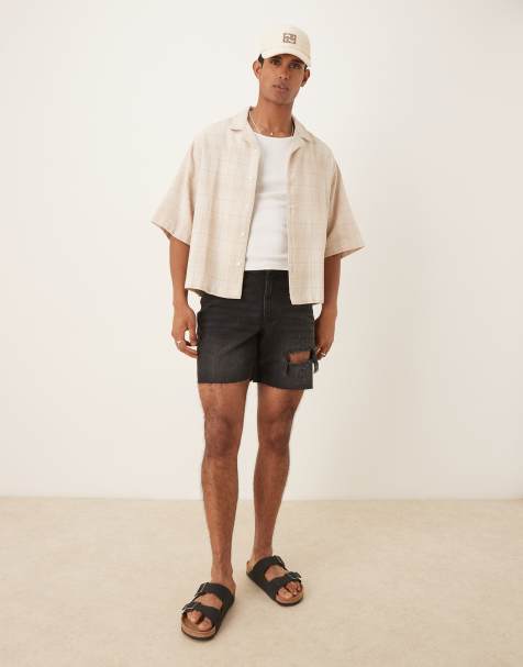ASOS DESIGN mid length slim denim shorts with rips in black - view 1