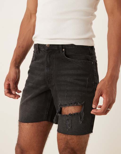 ASOS DESIGN mid length slim denim shorts with rips in black