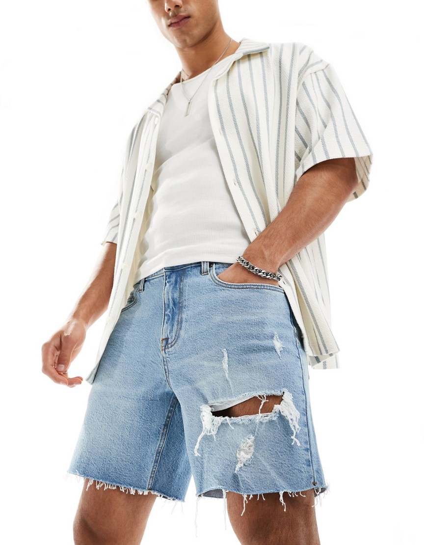 ASOS DESIGN mid length slim denim shorts with rips in light wash blue