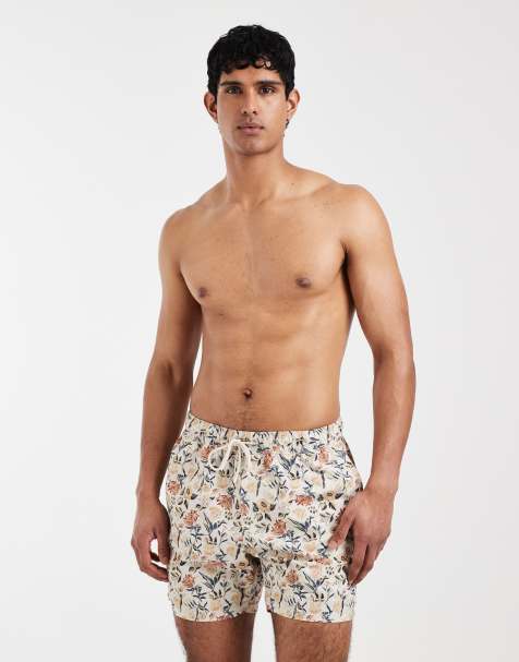 ASOS DESIGN mid-length swim shorts in floral print in beige - view 1
