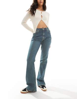 mid rise flare jeans in dark tinted blue