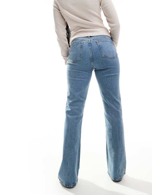 ASOS DESIGN mid rise flare jeans in light vintage wash