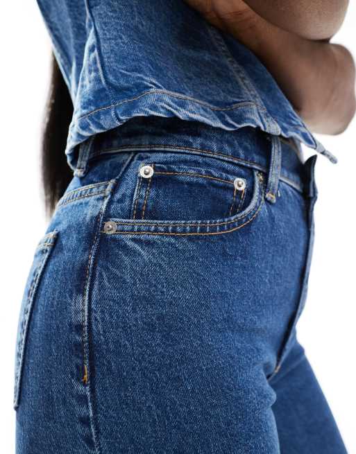 ASOS DESIGN mid rise flare jeans in mid blue