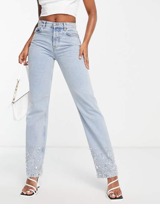 ASOS DESIGN mid rise straight jeans in light blue with embellished hem