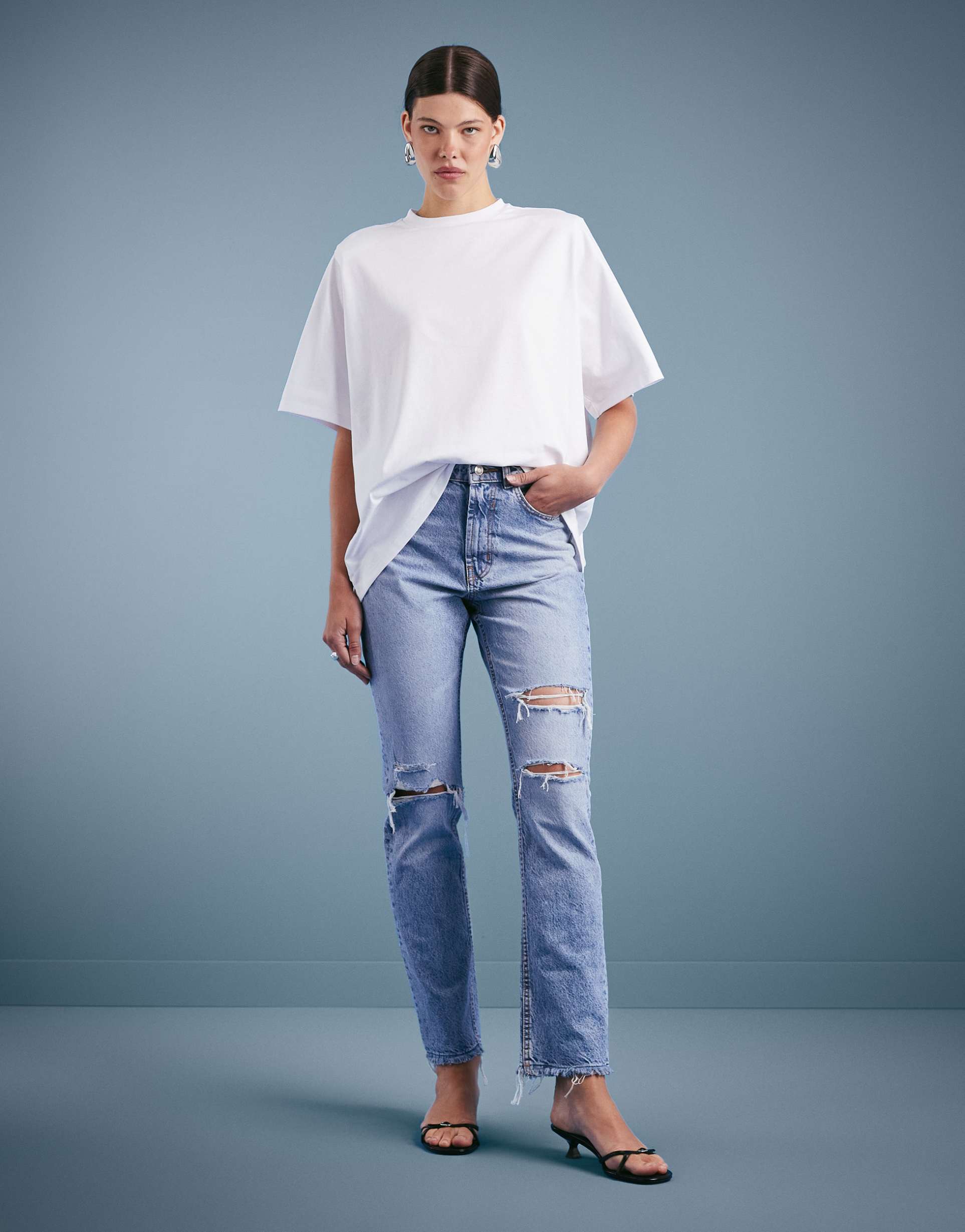 asos design mid rise straight jeans in lightwash with rips circular design collection