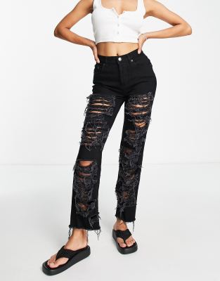 mid rise straight jeans with extreme rips in black