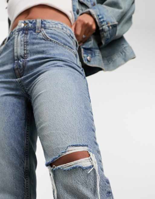ASOS DESIGN mid rise straight jeans with knee rip in blue