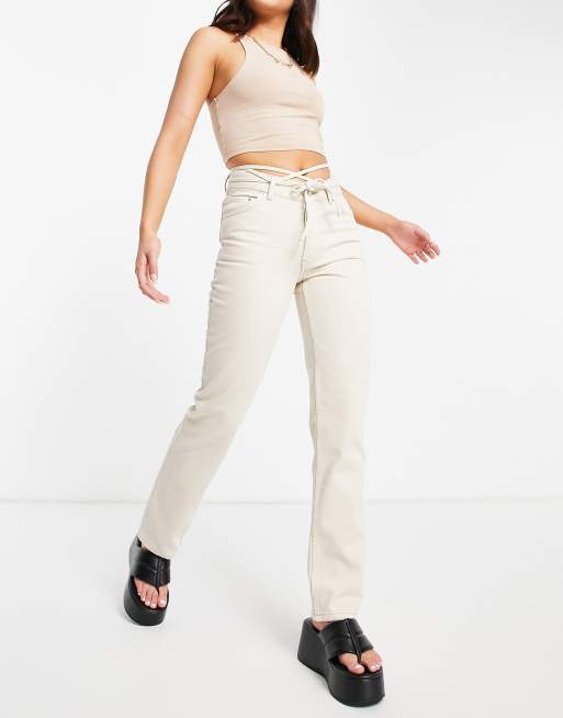 ASOS DESIGN mid rise straight leg jeans in ecru with strap detail | ASOS