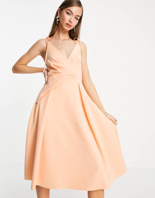ASOS DESIGN - Midi skaterjurk met spaghettibandjes en overslag in abrikoosroze