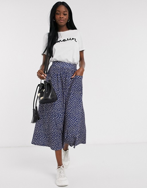 ASOS DESIGN midi skirt with pockets in pink and blue spot print