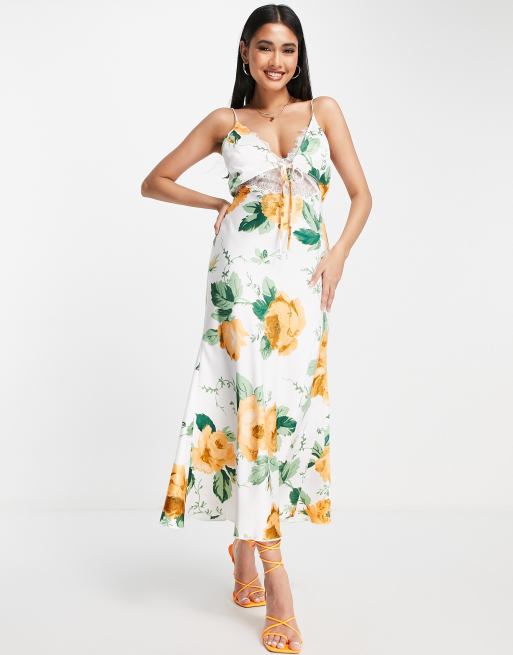 ASOS DESIGN - Midi-slipdress van satijn met detail van delicaat kant en strikje voor in bloemenprint
