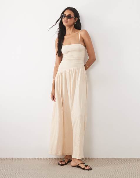 ASOS DESIGN – Midi-Trägerkleid in Schwarz mit Knitterstruktur, gebundenem Rücken und asymmetrischer Taille - view 1
