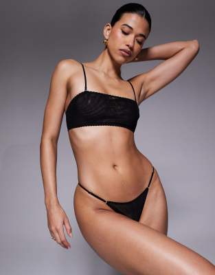 ASOS DESIGN - Mila - Tanga aus Netzstoff in Schwarz mit verstellbaren Seiten