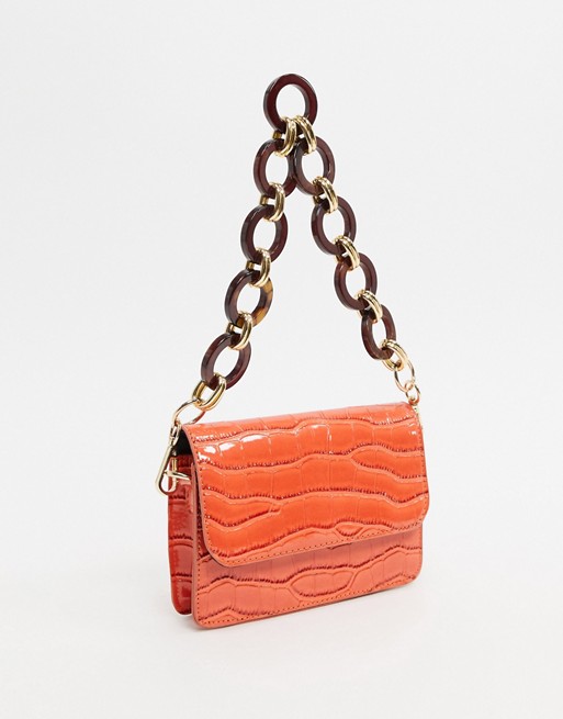 ASOS DESIGN mini bag in oversized orange croc with statement strap
