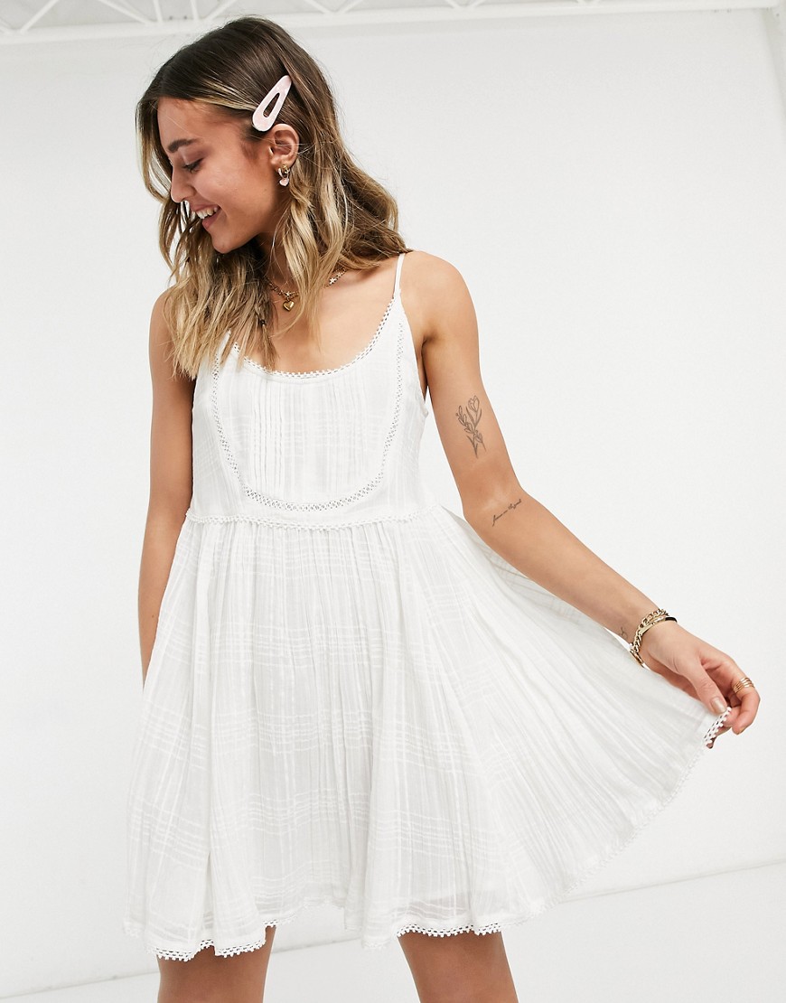ASOS DESIGN mini cami smock sundress with pintucks and crochet lace in white