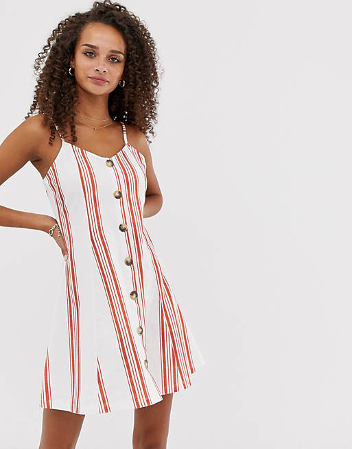 ASOS DESIGN mini cami swing dress with faux wood buttons in stripe